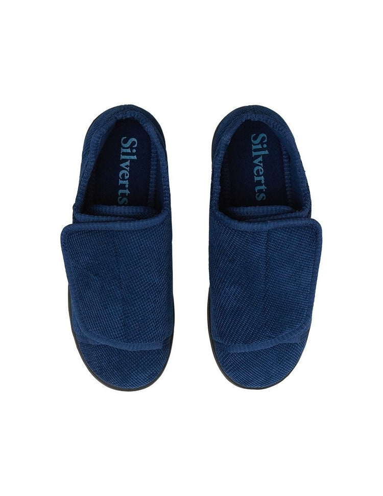 Pair of women’s navy blue wide non slip slippers with large velcro closure.