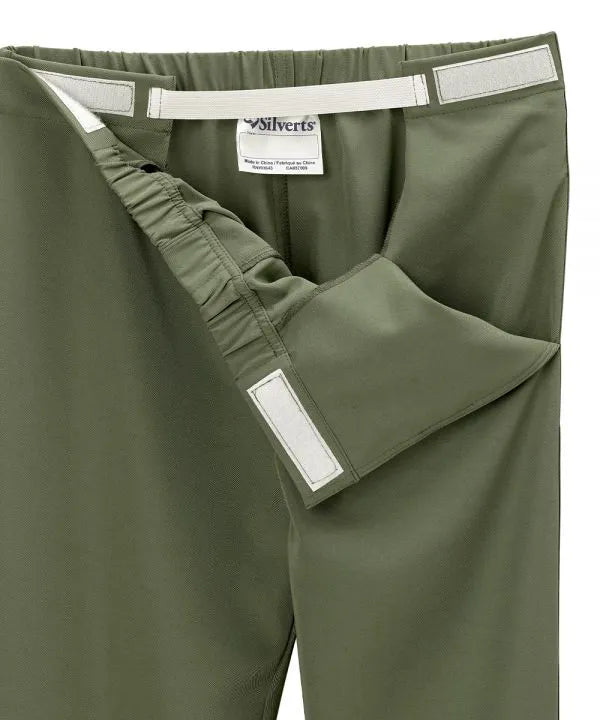 Women’s olive pants with side closure, adjustable straps, and loop fasteners on waistband. open view