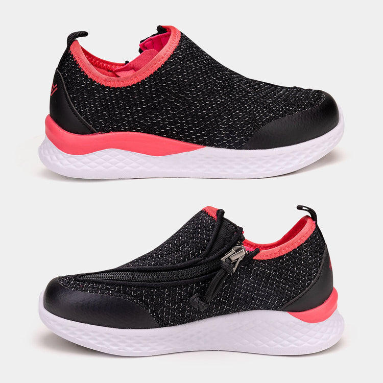 Black kids shoe with white bottom, hot pink accents, and side zipper access.