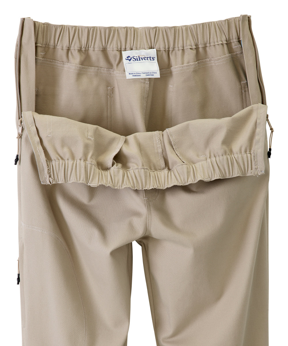 Khaki dressing pants with the zippers on side wide open showing the easy accessibility