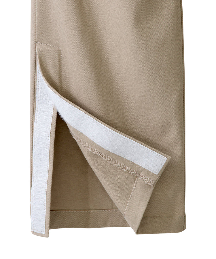 Bottom of khaki dressing pants with velcro tab closures and magnet leg opening