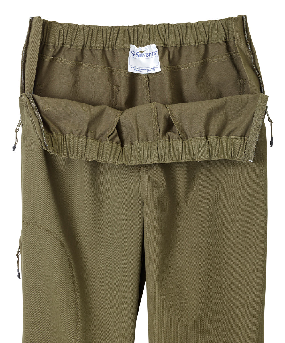Olive dressing pants with the zippers on side wide open showing the easy accessibility
